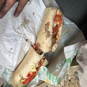 Subway - a sandwich on a wrapper and a pair of shoes - Sandwiches Near Me - Twentynine Palms, California