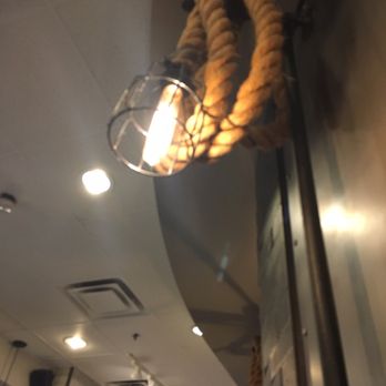 Starbucks - a light hanging from the ceiling of a coffee shop - Coffee & Tea Near Me - Toronto, Ontario