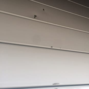 Atlas Door & Gate, Inc - Damaged door by installers! - Garage Door Services Near Me - Medley, Florida Atlas Door & Gate, Inc - Damaged door by installers! - Garage Door Services Near Me - Medley, Florida