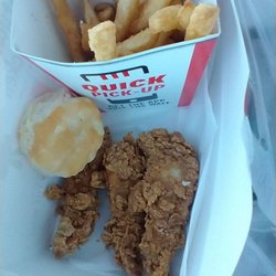 KFC - 3 chicken strips, fries, and a biscuit.