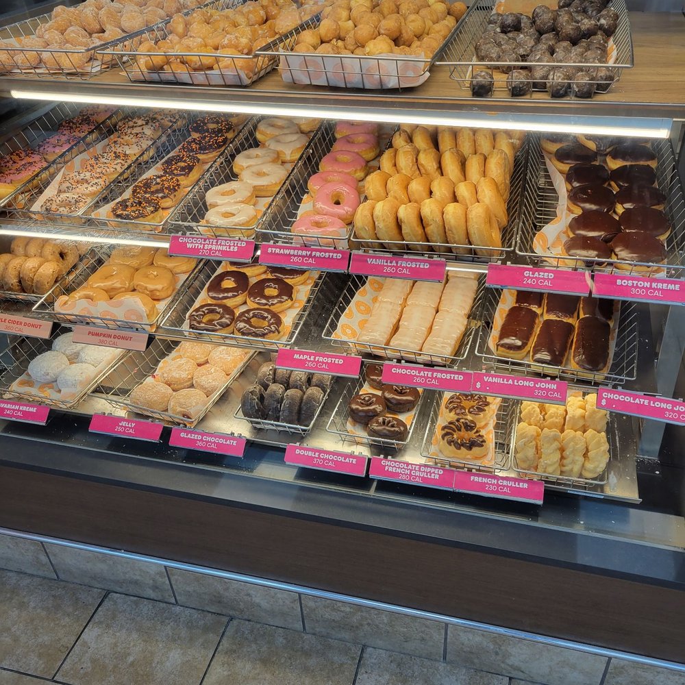 a variety of donuts in a display case a variety of donuts in a display case