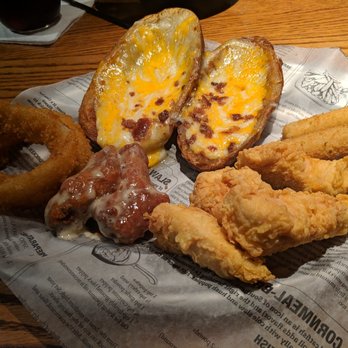 The Village Squire McHenry - Squire Favorites.   2 ea potato skins (large), cheese sticks, onion rings, chicken wings 4 ea chicken tenders.   Comes with dipping sauces. - Seafood Near Me - McHenry, Illinois
