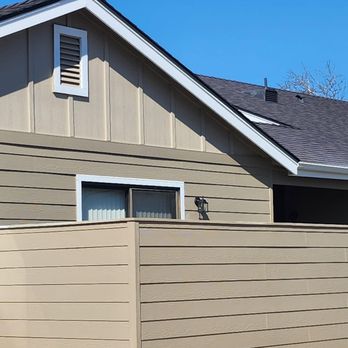 Bushco Contracting - a house with a fence in front of it - General Contractors Near Me - Fresno, California Bushco Contracting - a house with a fence in front of it - General Contractors Near Me - Fresno, California