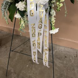 Aloha Floral - This is how the ribbon looks. Can't even read the first words. & the slash just makes the wording weird.