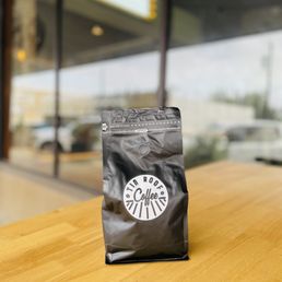 a bag of coffee sitting on a table a bag of coffee sitting on a table