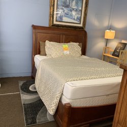 Hidden Treasures Thrift Shop - Queen-size wood bed with an IKEA mattress and box spring