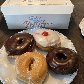 Yum Yum Bake Shops - From top left  Chocolate Glazed  Cherry Bomb  Glazed  Chocolate-Chocolate - Donuts Near Me - Colmar, Pennsylvania