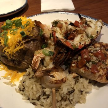 Red Lobster - Wood Fire grilled salmon, shrimp and lobster over rice pilaf and side of baked potato - Seafood Near Me - Pittsburg, California Red Lobster - Wood Fire grilled salmon, shrimp and lobster over rice pilaf and side of baked potato - Seafood Near Me - Pittsburg, California