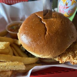 Green chili chicken sandwich and regular fries Green chili chicken sandwich and regular fries