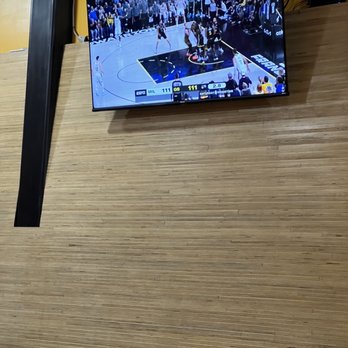 Flipside - a basketball game being played on a flat screen tv - Burgers Near Me - Oakland, California