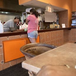 The employee just hanging out with girls instead of doing his job.