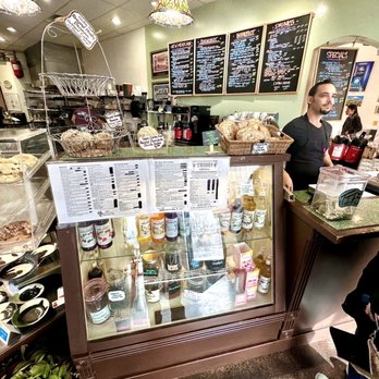 Tribes Coffee House - a man and a woman standing in front of the counter - Sandwiches Near Me - Santa Fe, New Mexico