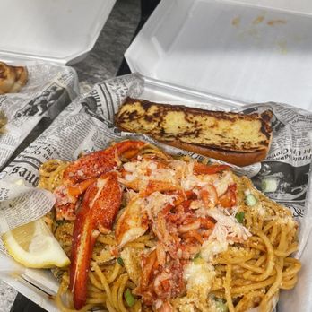 The Lobster Cage - a plate of pasta and bread - Seafood Near Me - Pensacola, Florida The Lobster Cage - a plate of pasta and bread - Seafood Near Me - Pensacola, Florida