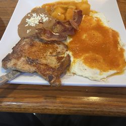 Fajitas Taqueria - Huevos Rancheros plate with pork chop was delicious.