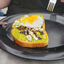 Avocado toast with balsamic drizzle and a poached egg Avocado toast with balsamic drizzle and a poached egg