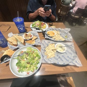 Taziki's Mediterranean Cafe - Tulsa - Greek Salad, whipped & spicy hummus, the vegetable feast, & tomato basil Sand which w/seasoned potatoes. - Mediterranean Near Me - Tulsa, Oklahoma