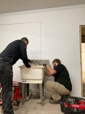 T M Johnson Bros Logo