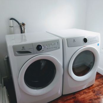 Salisbury Construction - a washer and dryer in a room - General Contractors Near Me Salisbury Construction - a washer and dryer in a room - General Contractors Near Me
