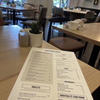 Boxwood Cafe - a menu on a table - Wine Bars Near Me - Portland, Oregon