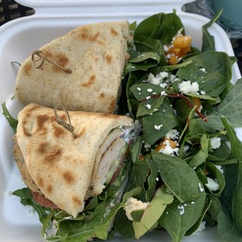 Reggie's Bistro - Grilled chicken naan bread wrap with hummus and yogurt sauce. With a side salad - American Near Me - Los Angeles, California Reggie's Bistro - Grilled chicken naan bread wrap with hummus and yogurt sauce. With a side salad - American Near Me - Los Angeles, California