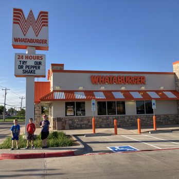 Whataburger - two people standing in front of whataburger - Burgers Near Me - Oklahoma City, Oklahoma