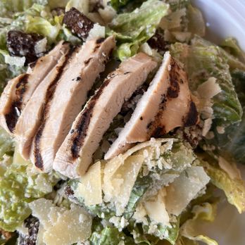 Pavilion - a closeup of a salad with chicken and lettuce - Bars Near Me - Bolton, New York