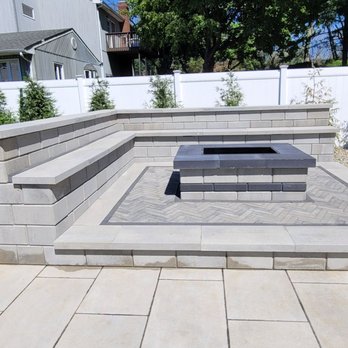 Semper Green Lawnscape - Raised Rafinato techo-bloc fire pit in greyed nickel with onyx border - Landscaping Near Me - Freehold, New Jersey Semper Green Lawnscape - Raised Rafinato techo-bloc fire pit in greyed nickel with onyx border - Landscaping Near Me - Freehold, New Jersey