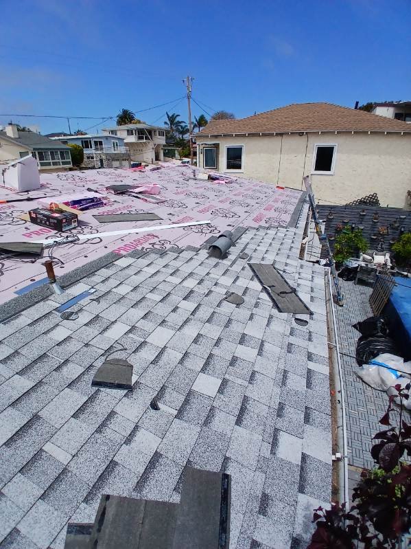 Slide of Reliance Roofing