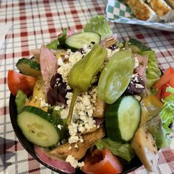 Pizza Bella - Small Greek salad with a side of focaccia bread.