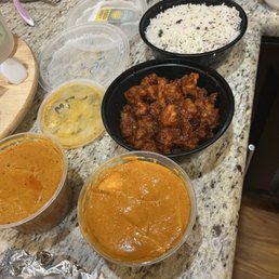 Butter Chicken, Chicken Tikka Masala, cauliflower, basmati rice, (missing from pic: garlic Nan and roti) Butter Chicken, Chicken Tikka Masala, cauliflower, basmati rice, (missing from pic: garlic Nan and roti)