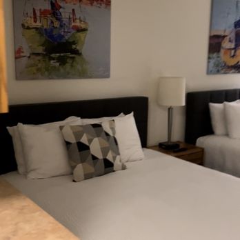 Firelite Lodge - Picture of one of the queen beds in our room (a little blurry since it's a screenshot from a video I took of our room) - Hotels Near Me - Tahoe Vista, California Firelite Lodge - Picture of one of the queen beds in our room (a little blurry since it's a screenshot from a video I took of our room) - Hotels Near Me - Tahoe Vista, California
