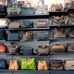 Braswell & Son Pawn Broker - Designer luxury bag wall.  All authentic only selling gently used.
