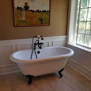 Construction Solutions - Old Fashion Free Standing Soaking Tub replaced an old built in neo angle tub - General Contractors Near Me