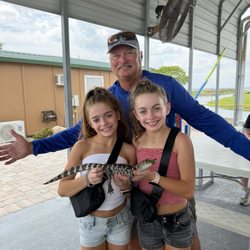 Crazy Gator Airboat Tours - Captain Tris Curry and Bandit the baby gator.