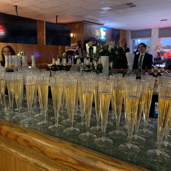 Saratoga Lanes - rows of champagne flutes lined up on a bar - Bowling Near Me - Saint Louis, Missouri Saratoga Lanes - rows of champagne flutes lined up on a bar - Bowling Near Me - Saint Louis, Missouri