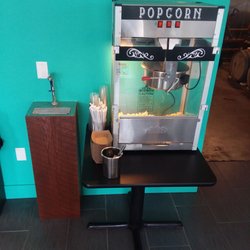Self serve complimentary water and popcorn