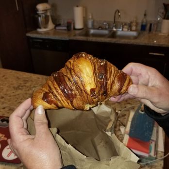Babette's Artisan Bakery - A regular croissant about 3/4 the size of your face! - Bakeries Near Me - Longmont, Colorado