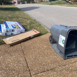 Waste Industries - This is how they left my garbage. At least this time the can was in my drive rather than the bottom of the hill