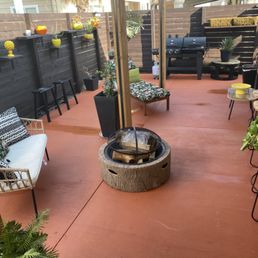 a patio with a fire pit