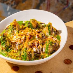 Curry Up Now Indian Restaurant and Catering - Samosa chaat topped with chutneys, spices and fresh herbs from Curry Up Now