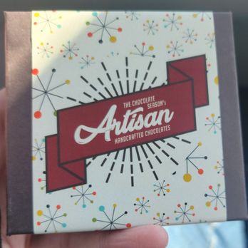 The Chocolate Season - a hand holding a box - Desserts Near Me - Lincoln, Nebraska The Chocolate Season - a hand holding a box - Desserts Near Me - Lincoln, Nebraska