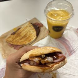McDonalds - Bacon Roll with Brown Sauce, Bacon & Cheese Toastie, and Mango Pineapple Smoothie.