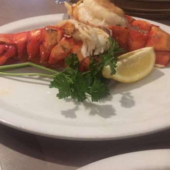 Mama Mia's - Twin lobster tails. Slightly overcooked but a decent size for the price. - Pizza Near Me - Redford, Michigan