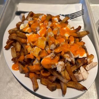 Poutine Centrale - Buffalo sauce on the poutine - Poutineries Near Me - Montreal, Quebec