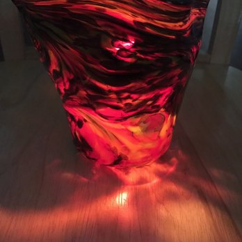 Caliente Hot Glass - Kira's looks cool with lit candles. - Art Galleries Near Me - San Antonio, Texas