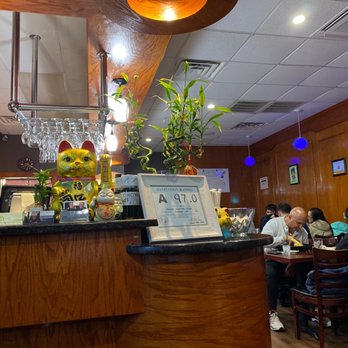 Wasabi - people sitting at a table in a restaurant - Japanese Near Me - Jacksonville, North Carolina