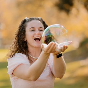 Coast 2 Coast Bubbles - Bubble Girl Christine catching a bubble. A trick we teach at parties! - Party Equipment Rentals Near Me Coast 2 Coast Bubbles - Bubble Girl Christine catching a bubble. A trick we teach at parties! - Party Equipment Rentals Near Me