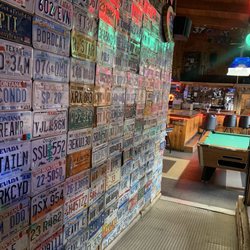 Snow Creek Saloon - Wall of license plates alongside the walls.