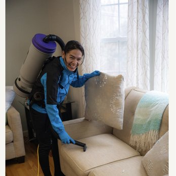 Cleaning Solutions of CT - Vacuuming the sofa in the living room - Home Cleaning Near Me - Danbury, Connecticut Cleaning Solutions of CT - Vacuuming the sofa in the living room - Home Cleaning Near Me - Danbury, Connecticut