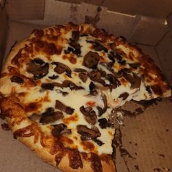 Mugly's - Small Mushroom Pizza.  About $12.  Super Cheesy And Filling.  I Could Only Eat Half.  Ask For Well Done So It Looks Like This.